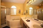 Queen master bedroom with full ensuite, soaker tub, glass shower
